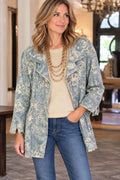 Blue and white floral jacket worn by a woman