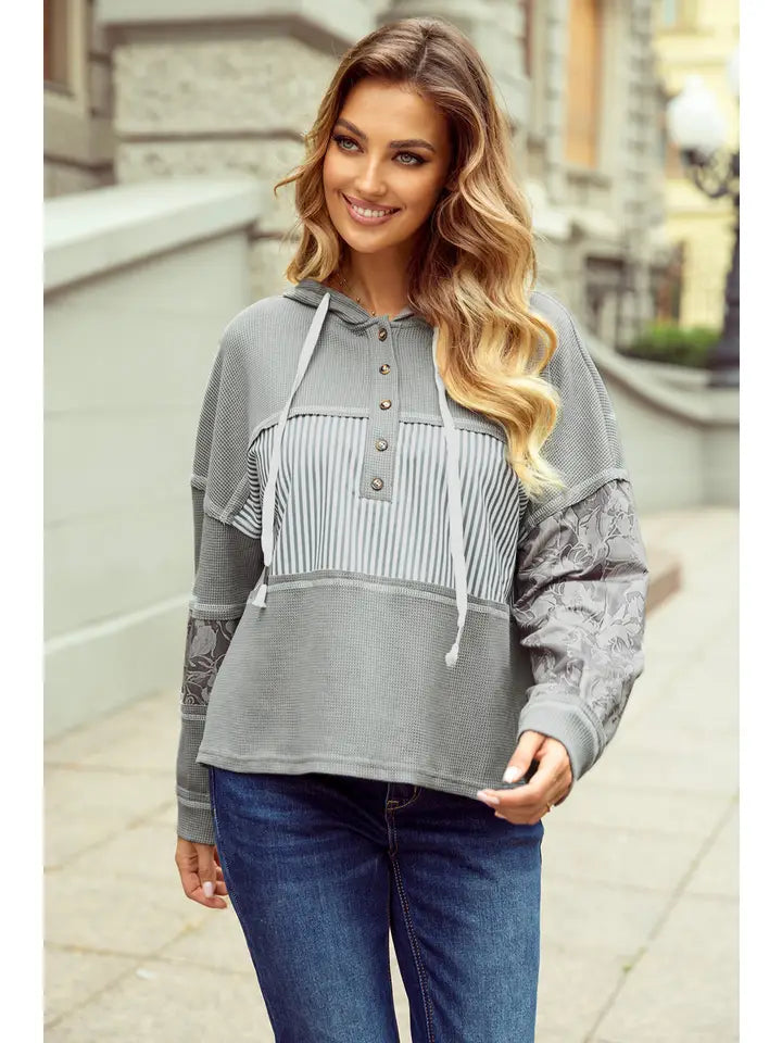 Gray waffle-knit hoodie with floral jacquard sleeve panels and striped button placket, second view