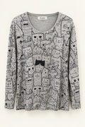 Cat-print top in a studio setting