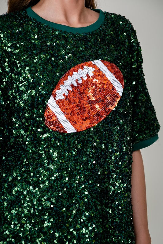 Close-up of green sequin football top with sequin football graphic on chest