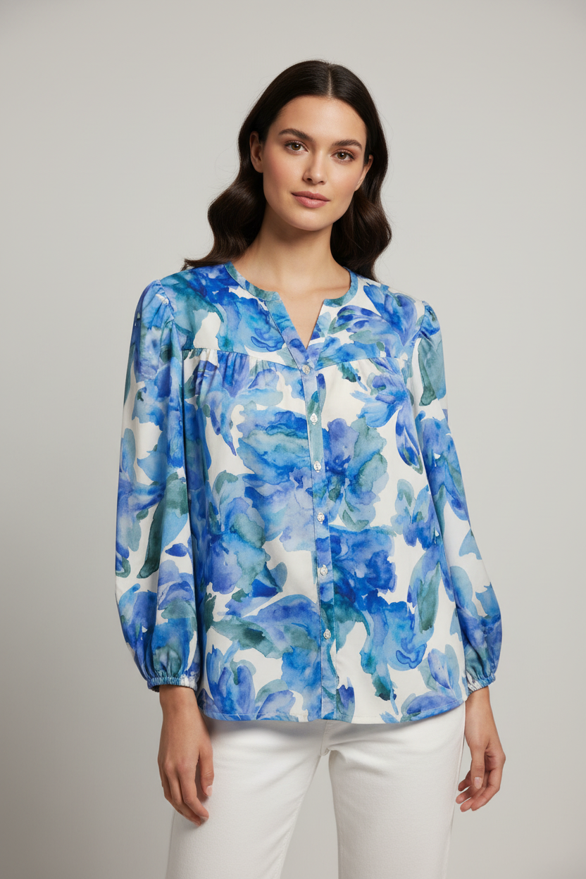 Model wearing blue watercolor floral blouse
