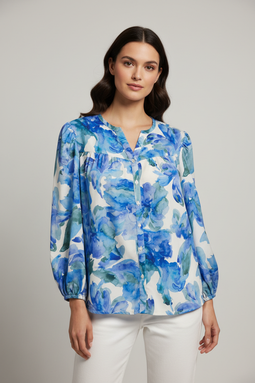 Model wearing blue watercolor floral blouse