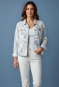 Woman wearing a floral palm print jacket