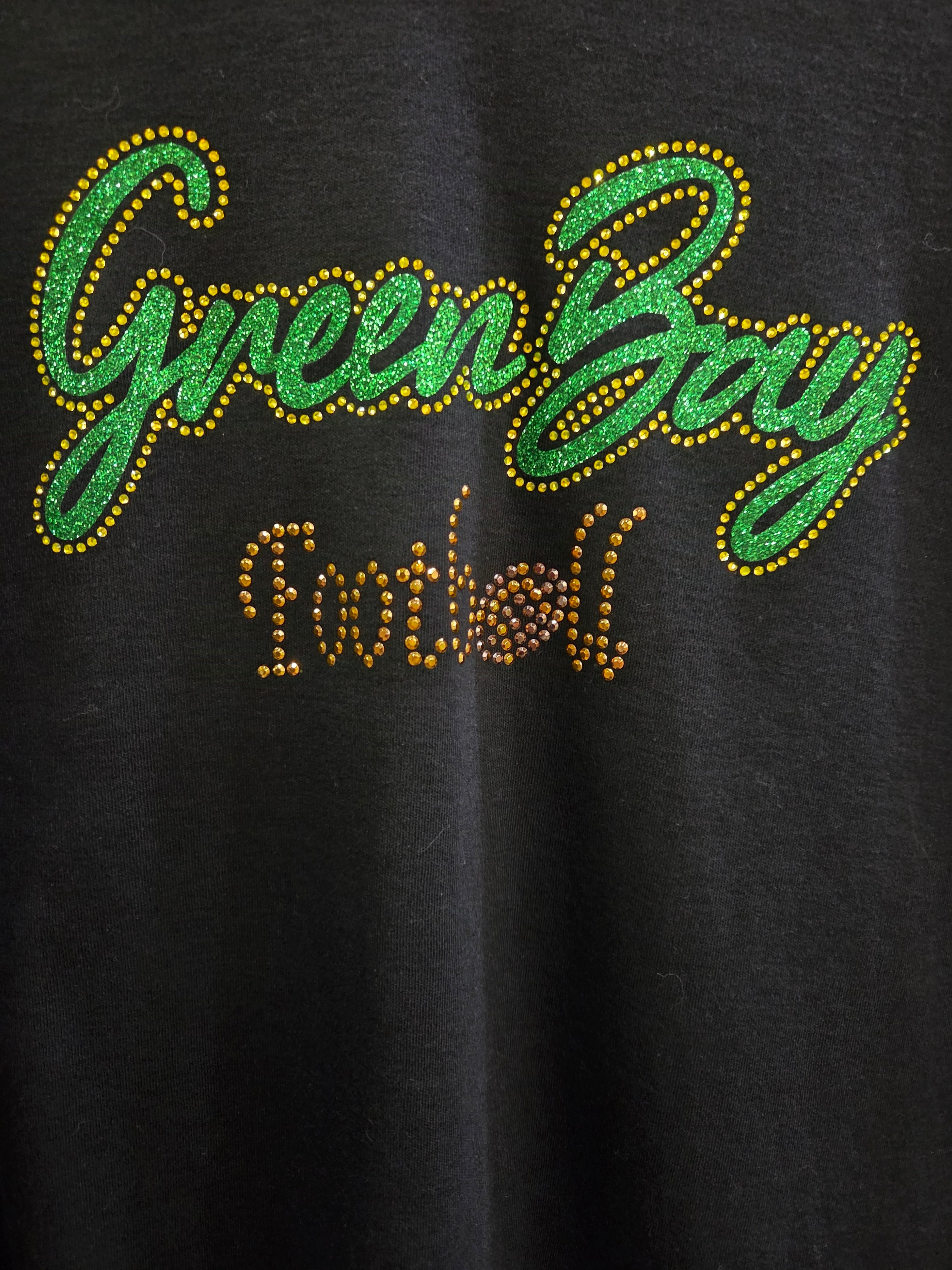Close-up of Green Bay Football glitter and rhinestone lettering
