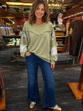Sage patchwork sleeve sweatshirt with floral print sleeves and raw-edge yoke detail